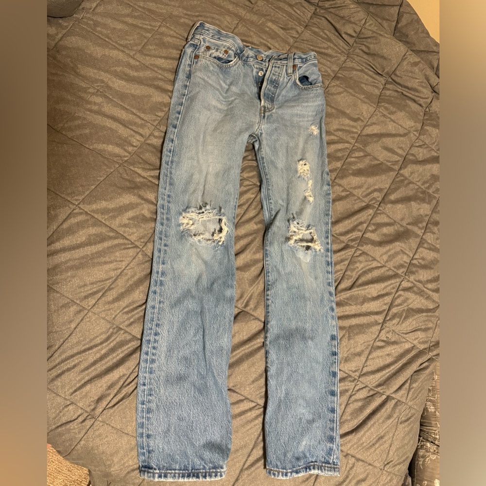 These are Levi’s Premium straight jeans, in a size 24x30, in a color light blue.